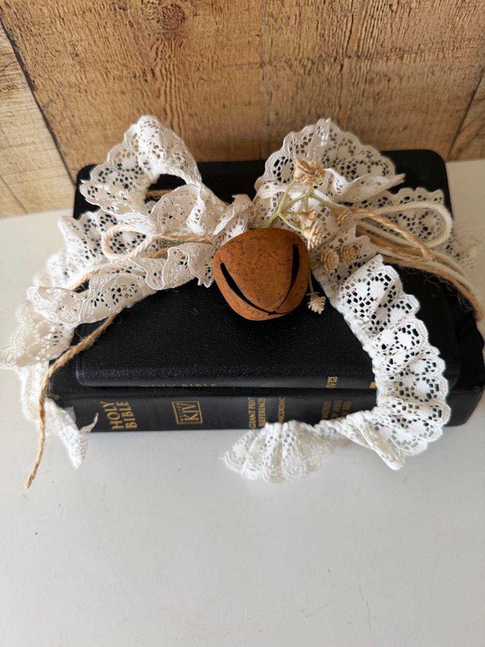 Black Leather Holy Bible Bookstack with Lace Trim, Jute & a Rustic Bell Accent